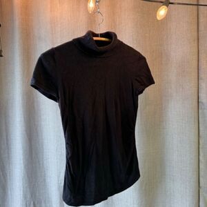 Black short sleeved ANN TAYLOR turtle neck with ruching at sides - Petite S